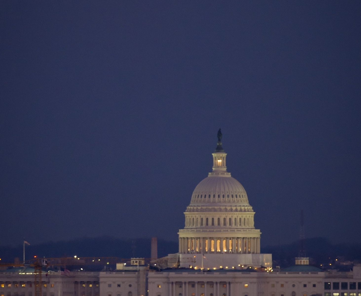 Picture of capital hill with a full moon.