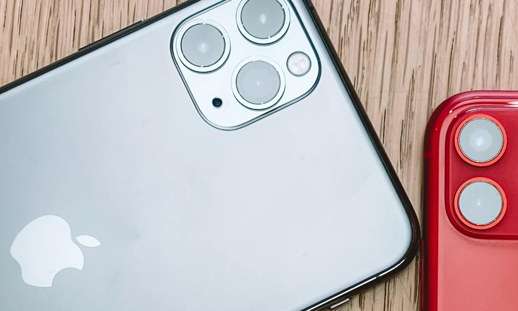 Silver iPhone 11 on a brown surface.